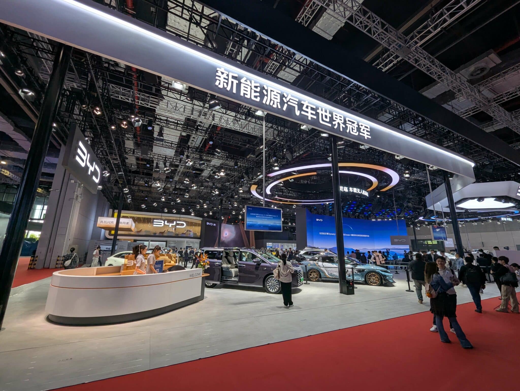 Auto Shanghai exhibition hall with new-energy vehicles and visitors