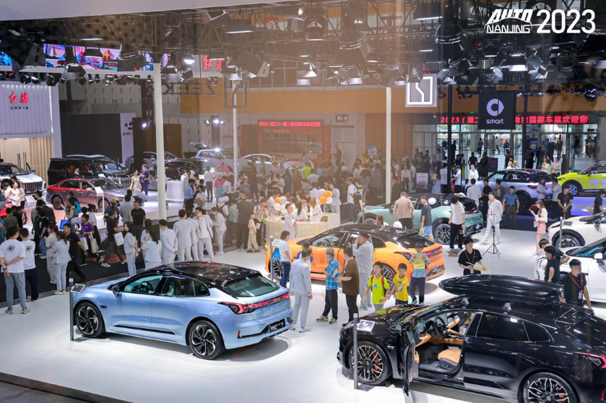 Nanjing International Automobile Exhibition hall with visitors and vehicles